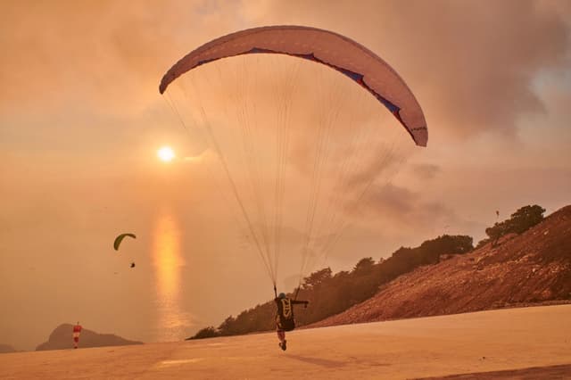 Pilot landing into a golden sunset